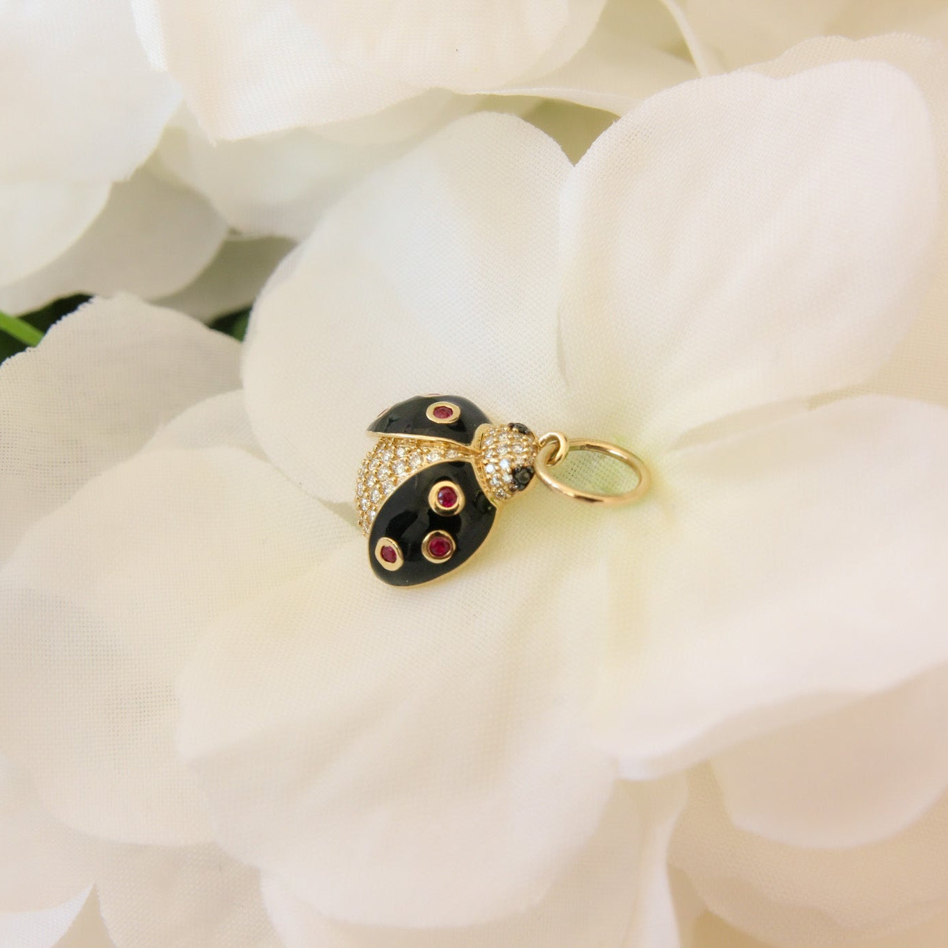 Jewelry box with black and gold design on white flowers