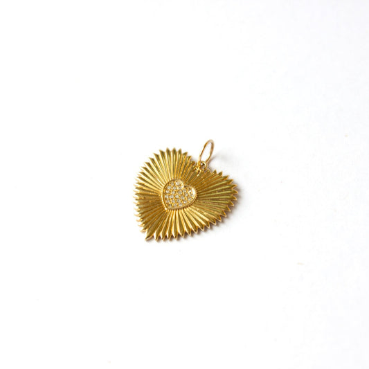 Gold pendant on a white background
