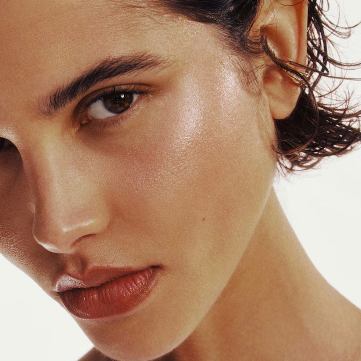 Close-up of a woman's face with a neutral background