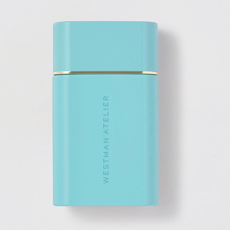 Light blue cylindrical container with 'Westman Atelier' branding on a light gray background