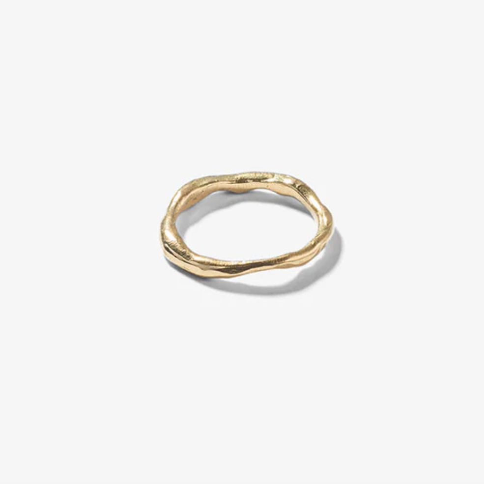 Gold ring on a white background